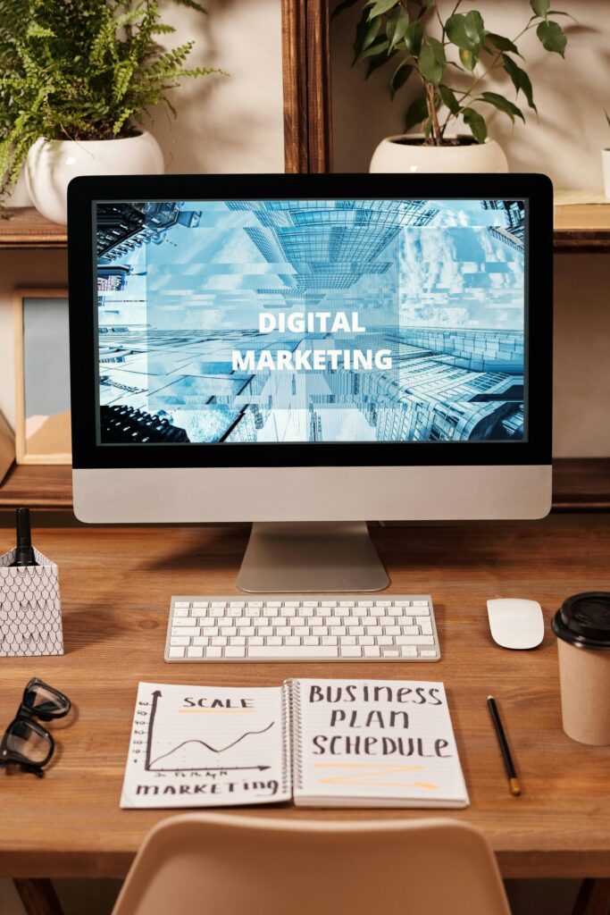 pexels-photo-6476808-6476808 Contemporary office setup featuring digital marketing strategy on a computer screen, ideal for business technology themes.